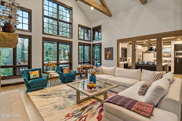 57 Mccoy Creek Dr Unit A, Edwards, CO 81632 - living area with high vaulted ceiling, beam ceiling, and wood finished floors