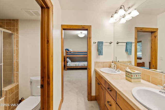 57 Mccoy Creek Dr Unit A, Edwards, CO 81632 - full bath featuring ensuite bathroom, a shower with door, and double vanity