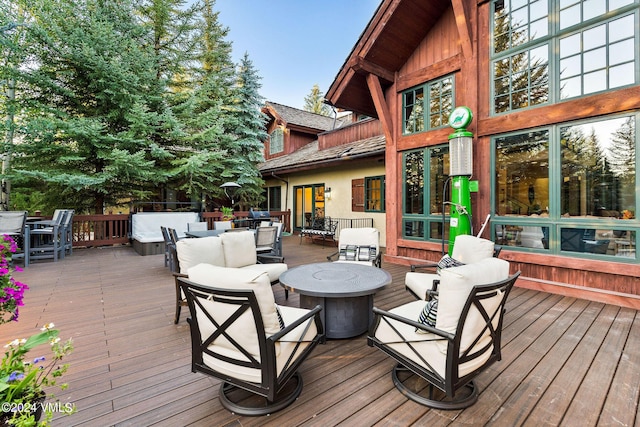 57 Mccoy Creek Dr Unit A, Edwards, CO 81632 - deck with outdoor dining area and an outdoor living space with a fire pit
