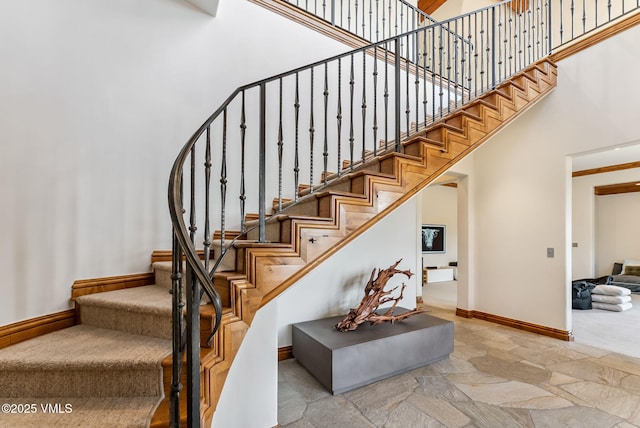 196 Spring Creek Ln, Edwards, CO 81632 - stairs featuring a towering ceiling and stone finish flooring