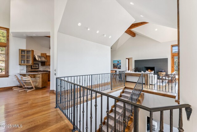 196 Spring Creek Ln, Edwards, CO 81632 - hallway with an upstairs landing, high vaulted ceiling, light wood-style floors, recessed lighting, and beam ceiling