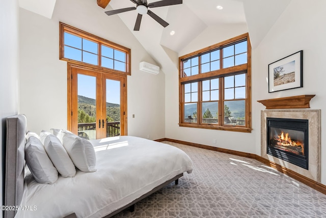 196 Spring Creek Ln, Edwards, CO 81632 - carpeted bedroom featuring access to exterior, a mountain view, french doors, an AC wall unit, and high vaulted ceiling