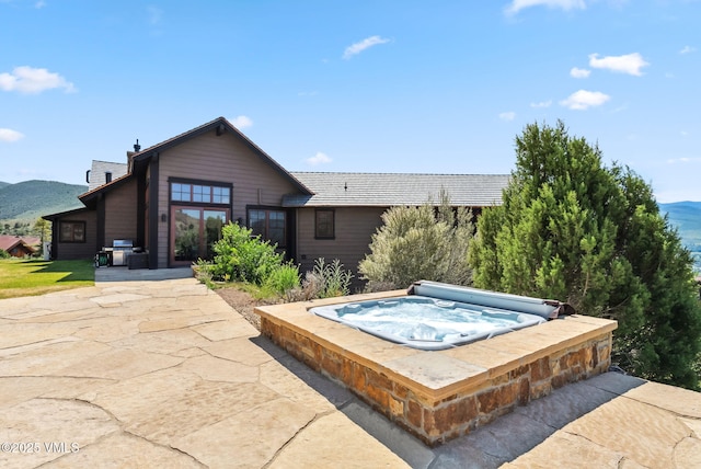 196 Spring Creek Ln, Edwards, CO 81632 - view of pool featuring a covered hot tub, a mountain view, area for grilling, and a patio