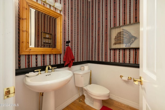 4465 Glen Falls Ln, Vail, CO 81657 - half bathroom featuring wallpapered walls and wood finished floors