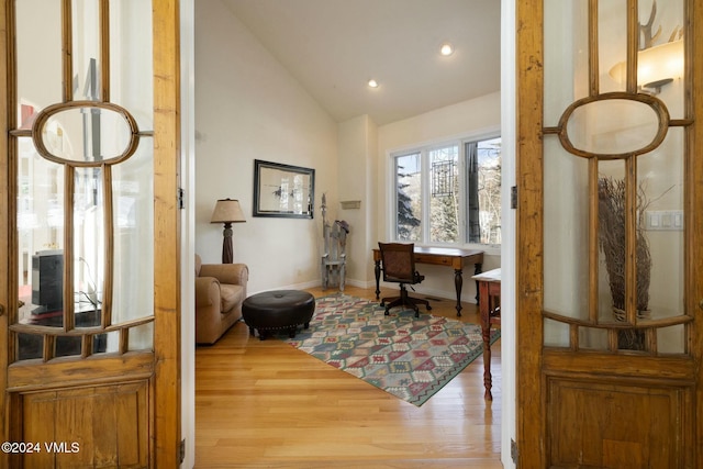 office space featuring hardwood / wood-style flooring and vaulted ceiling