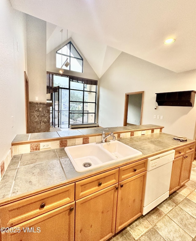 240 Chapel Pl Unit Br-309, Avon, CO 81620 - kitchen with white dishwasher, lofted ceiling, and light stone finish floors