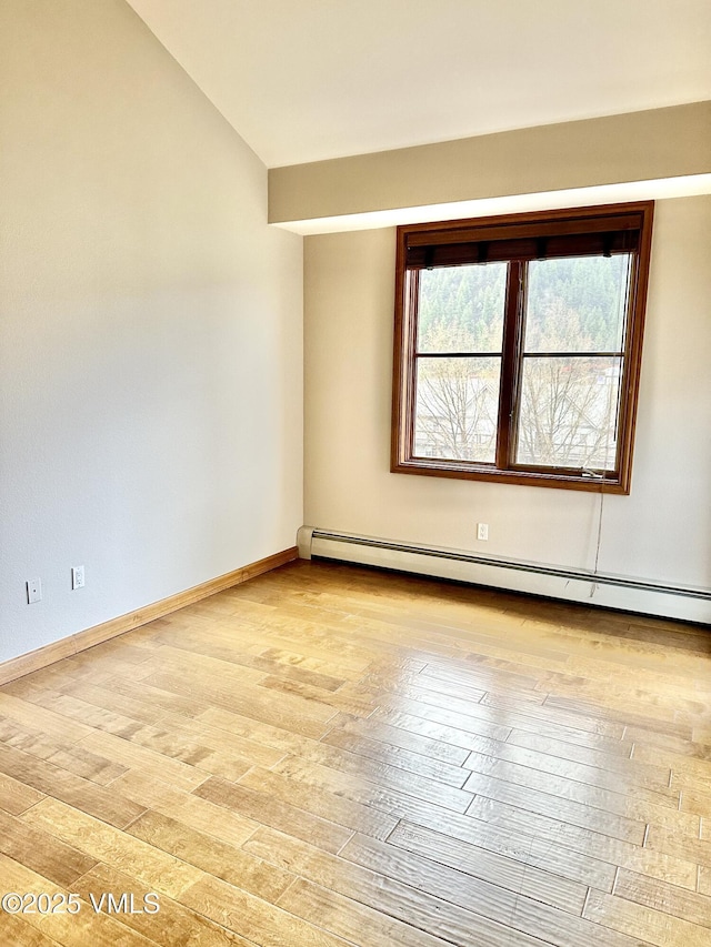 240 Chapel Pl Unit Br-309, Avon, CO 81620 - unfurnished room with baseboard heating, light wood-style flooring, and vaulted ceiling
