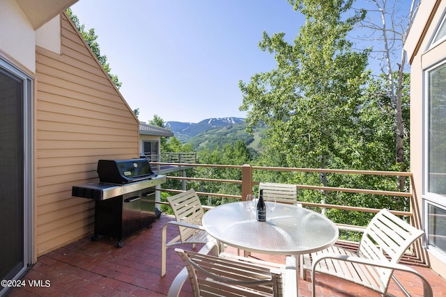 balcony with a grill and a mountain view