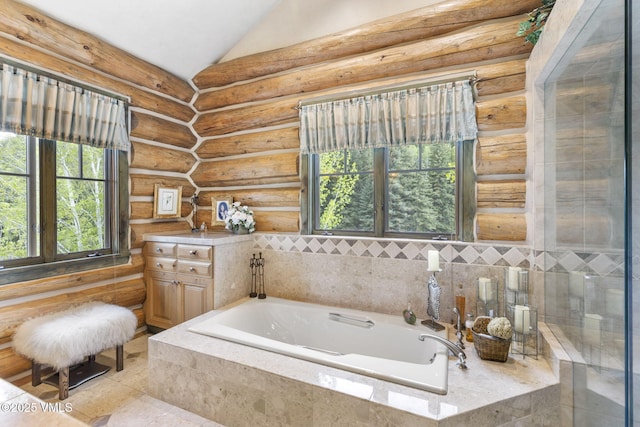 1416 Red Draw, Edwards, CO 81632 - full bathroom featuring a garden tub, vaulted ceiling, and log walls