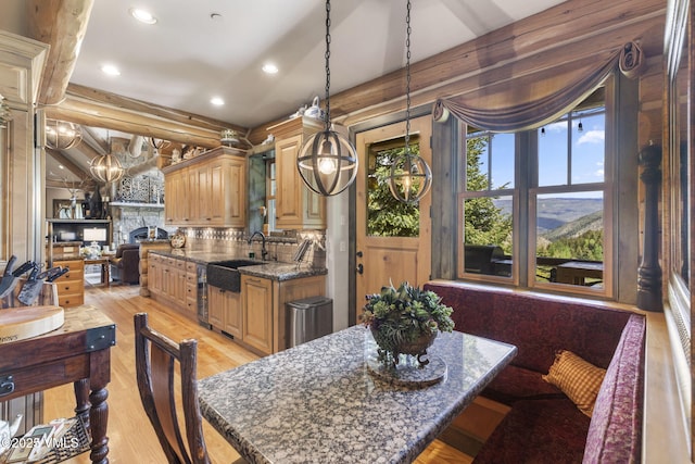 1416 Red Draw, Edwards, CO 81632 - dining space with recessed lighting, light wood-style floors, a stone fireplace, and a chandelier