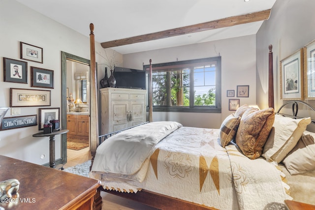 1416 Red Draw, Edwards, CO 81632 - bedroom featuring beam ceiling and connected bathroom