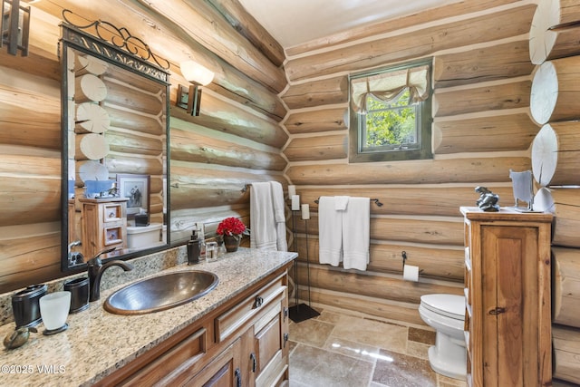 1416 Red Draw, Edwards, CO 81632 - bathroom featuring vanity and log walls