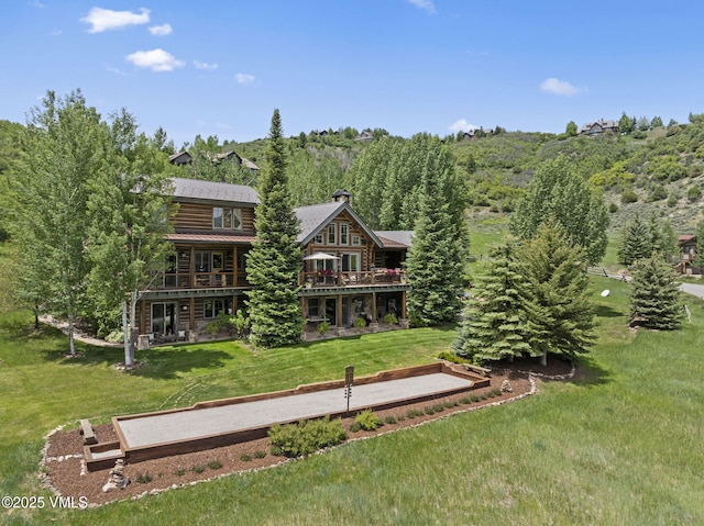 1416 Red Draw, Edwards, CO 81632 - rear view of house with a yard, log siding, and a wooded view