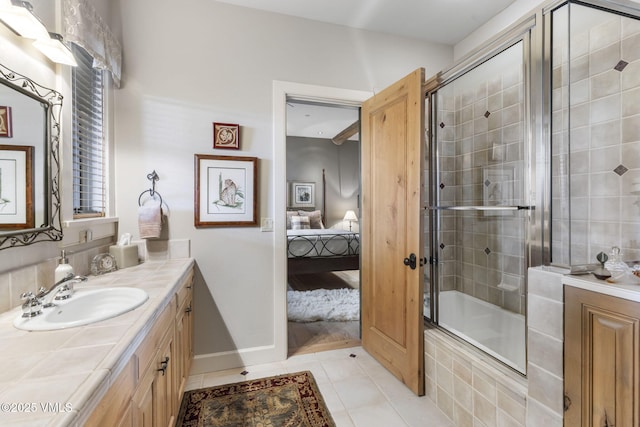 1416 Red Draw, Edwards, CO 81632 - ensuite bathroom with vanity, tile patterned floors, and tiled shower / bath combo
