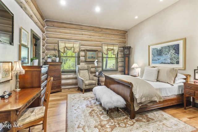 1416 Red Draw, Edwards, CO 81632 - bedroom featuring rustic walls, light wood-type flooring, and recessed lighting