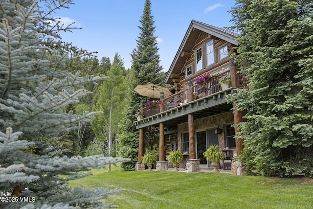 1416 Red Draw, Edwards, CO 81632 - rear view of house featuring stone siding, a deck, and a lawn