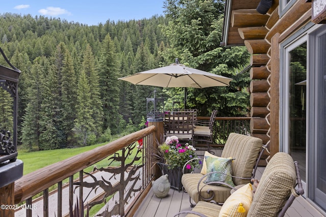 1416 Red Draw, Edwards, CO 81632 - wooden terrace featuring a forest view