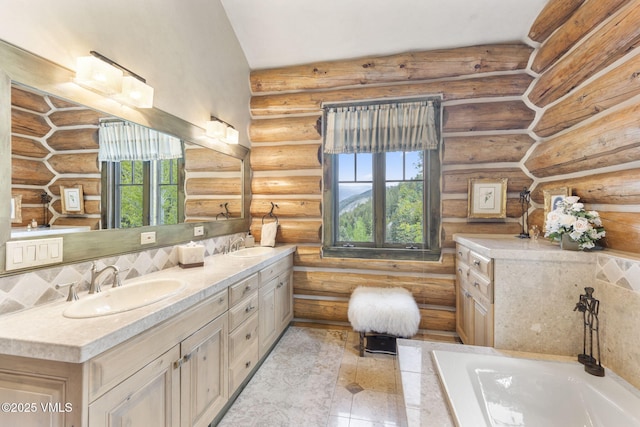 1416 Red Draw, Edwards, CO 81632 - bathroom with log walls, double vanity, and a bath