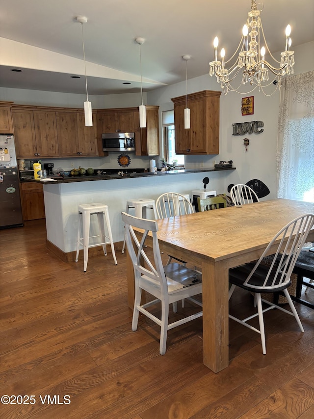 40 Bunker Way, Eagle, CO 81631 - dining space featuring dark wood finished floors and a chandelier
