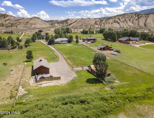 birds eye view of property with a mountain view and a rural view