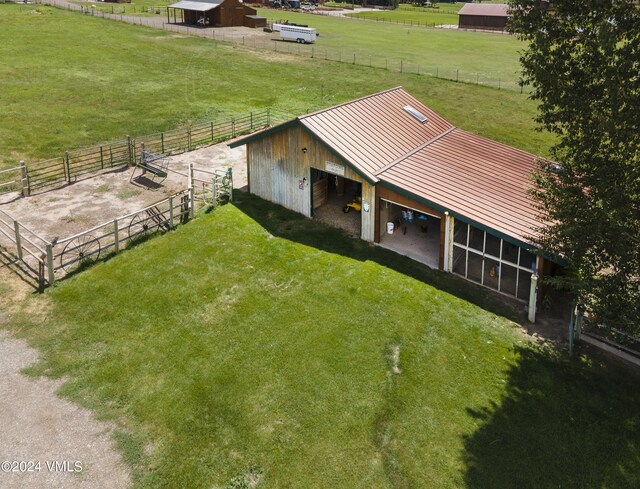 birds eye view of property with a rural view