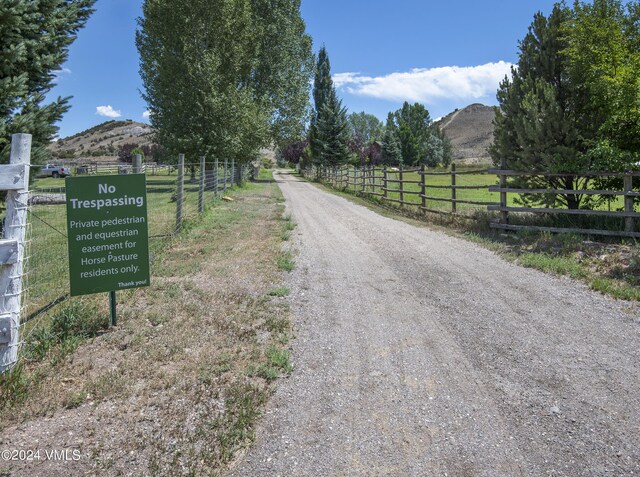 view of street featuring a mountain view and a rural view