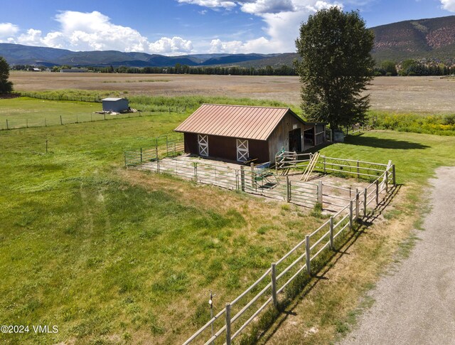 exterior space with a mountain view and a rural view