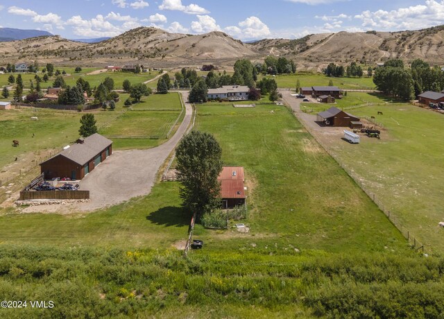 bird's eye view with a mountain view and a rural view