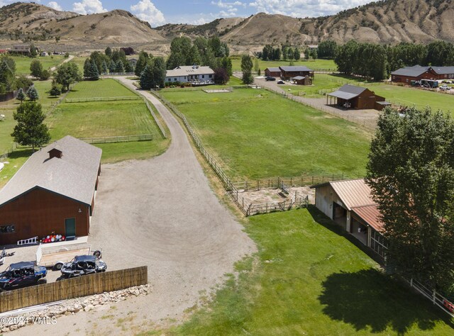 drone / aerial view featuring a rural view and a mountain view