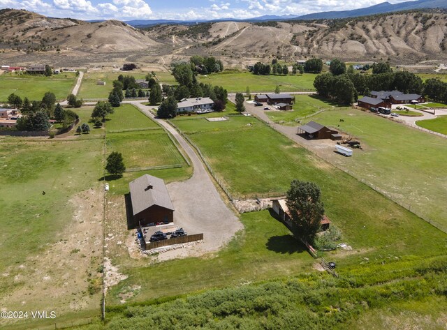 aerial view with a mountain view and a rural view