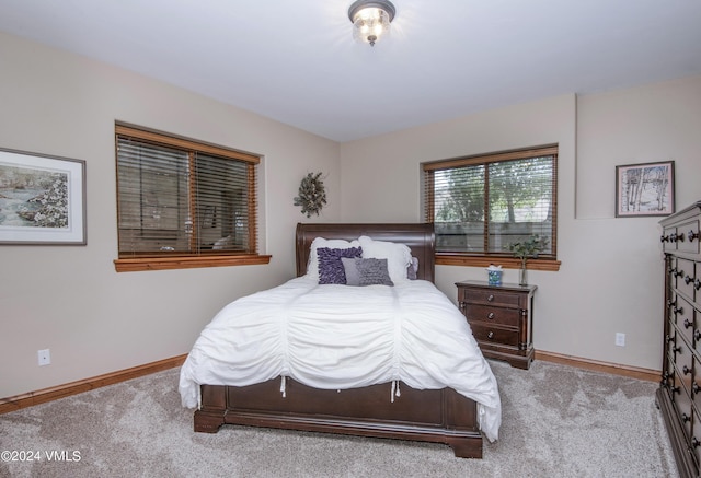 bedroom with light colored carpet