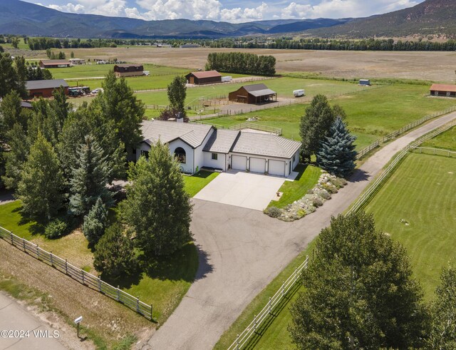 drone / aerial view with a mountain view and a rural view