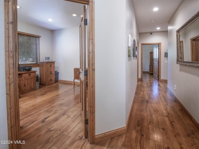 hallway featuring light hardwood / wood-style flooring