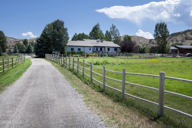 view of street featuring a mountain view and a rural view