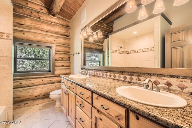 121 Hackamore Rd Unit A, Edwards, CO 81632 - bathroom featuring rustic walls, double vanity, wood ceiling, tile patterned flooring, and backsplash