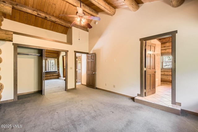 121 Hackamore Rd Unit A, Edwards, CO 81632 - unfurnished bedroom with a wood ceiling with exposed beams, carpet flooring, ensuite bath, a ceiling fan, and a closet