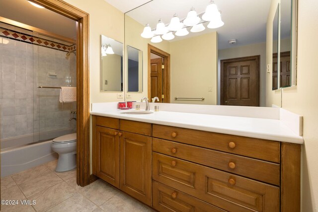 full bathroom with tile patterned floors, shower / tub combination, toilet, and vanity