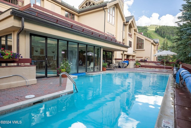 community pool featuring a patio