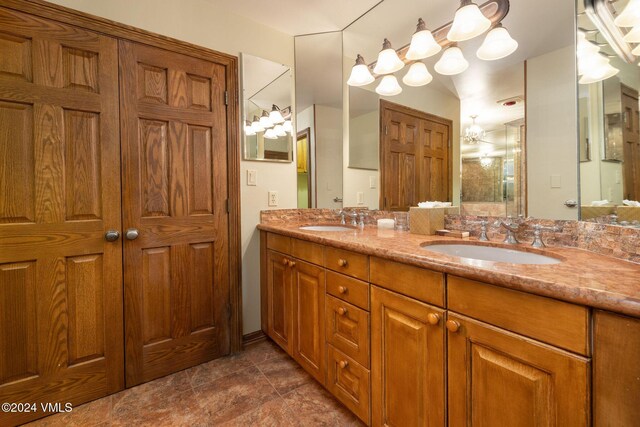 bathroom featuring a sink and double vanity