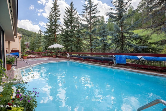 pool with a patio area