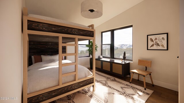 bedroom featuring wood-type flooring and lofted ceiling