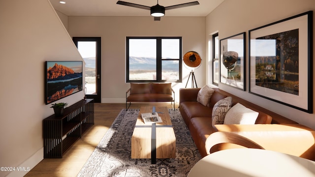 living room with ceiling fan and light hardwood / wood-style flooring