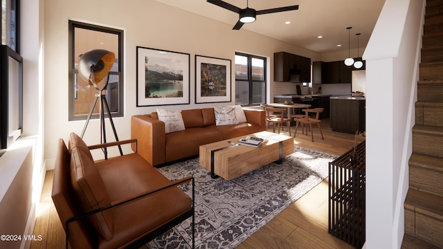 living room with ceiling fan and light wood-type flooring