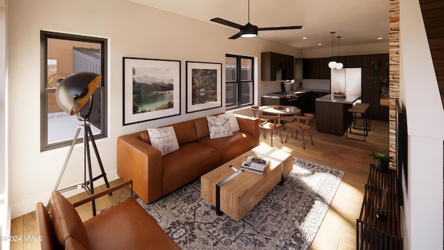 living room featuring ceiling fan and light hardwood / wood-style floors