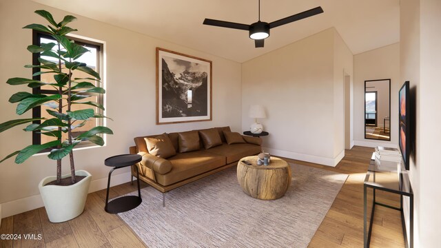 living room with hardwood / wood-style flooring, vaulted ceiling, and ceiling fan