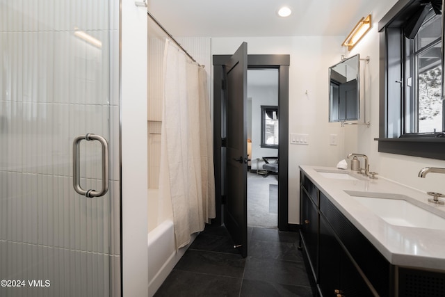 bathroom featuring shower / bath combination with curtain, tile patterned flooring, a sink, and double vanity