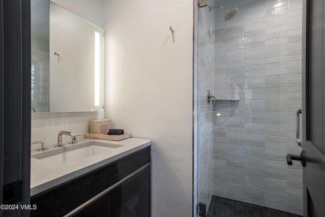 full bath featuring a shower stall and vanity