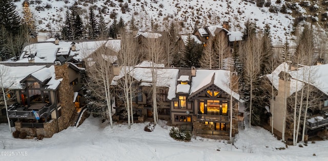 352 Cresta Rd, Edwards, CO 81632 - snow covered house featuring a chimney
