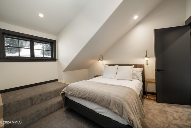 bedroom featuring light carpet, recessed lighting, baseboards, and lofted ceiling