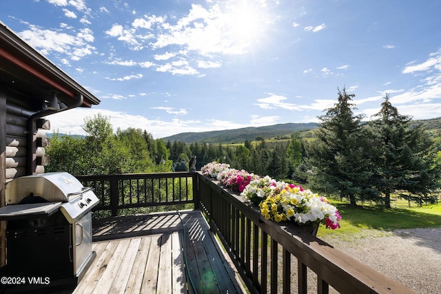 407 Meadow Rd, Edwards, CO 81632 - deck featuring a forest view, a mountain view, and a grill